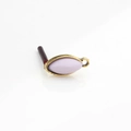 Close-up of vintage gold horse-eye resin component with a lilac finish for jewelry making - Water Pink