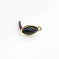 Macro detail of marquise-shaped gold alloy earring charms with black resin stones - Black