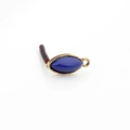 Detail of vintage gold alloy eye-shaped earring component with deep blue resin stone - Sapphire Blue