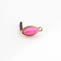Macro detail of vintage pink marquise resin stone in gold alloy frame earring finding - Pink Marble