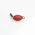 Macro shot of vintage gold alloy marquise red resin earring charms for DIY jewelry making - Rhodochrosite