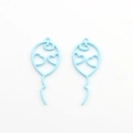 Close-up of light blue hollow balloon charms with heart cutouts for DIY jewelry making - Blue