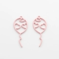 Close-up of pink heart balloon hollow charms for DIY jewelry making accessories - Pink