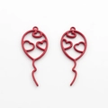 Close-up of red hollow metal balloon charms with heart details for DIY jewelry making - Red