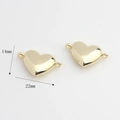 Detailed macro view showing a 22x14mm golden heart charm connector with dual rings - Double Loop Connector / Gold