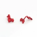 Detail of matte red bow-knot jewelry components with smooth metal paint finish - Red