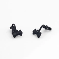 Detail view of matte black bow-shaped earrings with smooth finish and minimalist style - Black
