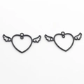 Close-up of two black heart wing charms for DIY jewelry making and necklace crafts - Black
