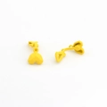 Detailed macro view of matte yellow geometric heart clip-on earrings with faceted design - Yellow