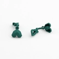 Macro view of matte dark green heart-shaped clip-on earring components for DIY jewelry - Green