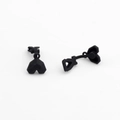 Detail view of matte black heart-shaped geometric stud earrings with faceted surface - Black