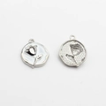 Detail of round rose flower enamel pendants showing front design and textured back - White-Silver