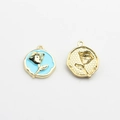 Detailed macro of gold alloy rose flower pendants with blue enamel for DIY earrings - Blue-Gold