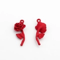 Macro shot of red matte rose pendants showing front and back texture for DIY jewelry making - Red