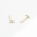 Close-up of cream-colored cylindrical DIY jewelry parts with precision top holes - White