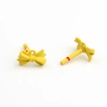 Detailed macro view of yellow matte bow earring charms with metal loops and red pin marks - Yellow