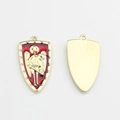 Close-up of red enamel shield pendant with golden winged knight for jewelry making - Red Gold