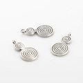 Detailed view of vintage silver alloy spiral pendants for DIY jewelry making accessories - Antique Silver