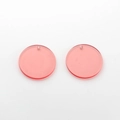 Close-up of pink translucent round resin pendants with pre-drilled holes for DIY jewelry - Pink Solid Round Disc