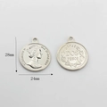 Detail of silver coin pendants showing Queen Elizabeth II portrait and floral wreath back - Silver Queen Portrait Style (02)