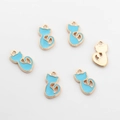 Detail of six blue enamel cat charms with golden alloy frames for DIY jewelry making - Blue