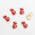Macro detail of red enamel cat pendants with gold alloy plating for DIY jewelry - Red