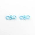 Detail view of sky blue infinity link charms with twisted rope texture for DIY jewelry - Blue