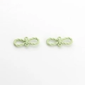 Close-up of matte light green infinity knot pendants for DIY jewelry making - Fruit Green