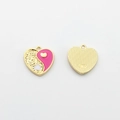 Close-up of alloy heart Yin Yang charm with pink enamel drip and gold grainy texture - Pink