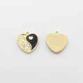 Macro view of heart-shaped yin yang alloy pendant with gold plating and SW engraved mark - Black