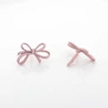 Detailed view of pink matte bow stud earrings made of high quality painted alloy - Smooth Large Style / Pink