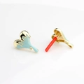 Detail view of drip oil heart earrings with golden lava texture and light blue finish - Blue