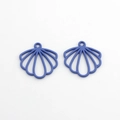 Macro view of royal blue scallop shell charms with hollow radial lines for DIY jewelry - Purple