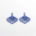 Close-up of periwinkle blue hollow leaf-shaped fan pendants for DIY jewelry making - Purple