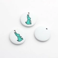 Detail of round wooden charms with geometric origami rabbit print for DIY jewelry making - Rabbit