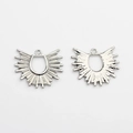Detailed close-up showing the front and back texture of silver sunburst fan charms - Silver