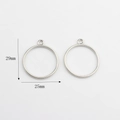 Detail view of 25mm hollow round alloy DIY earring charms with 29mm total height - Single Loop Style / Silver