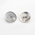 Detail of vintage silver sunflower alloy button with floral engraving and center bead - Purple