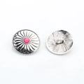 Macro detail of antique silver sunflower metal buttons with pink beads showing both sides - Pink