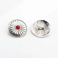 Detailed view showing the front and back of a vintage silver sunflower metal button - Rhodochrosite