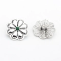 Detailed front and back views of vintage flower concho with green stone in antique silver - Green