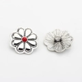 Detail of vintage zinc alloy flower button with antique silver finish and red center stone - Rhodochrosite