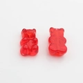 Detailed close-up of red gummy bear resin pendants for DIY jewelry making and crafts - Red