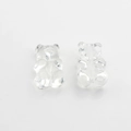 Macro shot of two transparent resin gummy bear beads with center holes for DIY jewelry - White