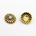 Macro detail of vintage gold alloy daisy flower buttons with marble pattern beads - Marble White