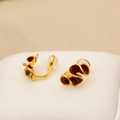 Golden flower clip-on earrings with deep red enamel petals and white silicone pads - Burgundy