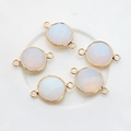Detailed macro view of five gold plated faceted white stone double-hole connectors - Gradient White