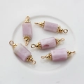 Detail of five cylindrical pink natural stone charms with gold-plated double eyelets - 22*6mm-24*7mm / Kunzite
