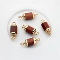 Detail of five gold-plated hexagonal stone connectors with dual rings for DIY jewelry - Golden Sand