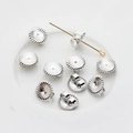Macro detail of silver flower petal earring backs and post closure for DIY jewelry - Round Earring Backs / White Gold